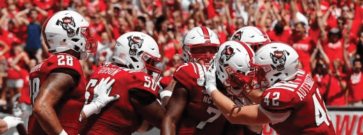 //assets.onlocationexp.com/prod/images/NC State Football Team Card 2.png